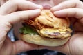 Man eating a hamburger, close-up, unhealthy eating concept Royalty Free Stock Photo