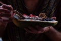 Anonymous Man eating healthy breakfast in papaya bowl Royalty Free Stock Photo