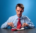 Man eating his tie Royalty Free Stock Photo