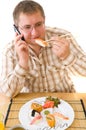 Man Eating an Japanese Food .