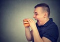 Man eating junk food double cheeseburger