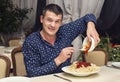 Man eating a large portion of pasta