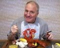 Man eating lobster dinner Royalty Free Stock Photo