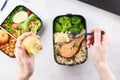 Man eating lunch from takeaway lunch box at working table Royalty Free Stock Photo