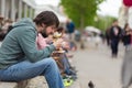 Man eating outdoors on food festival in Ljubljana, Slovenia. Royalty Free Stock Photo