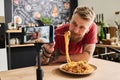 Man Eating Pasta On Camera