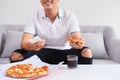 Man eating pizza having a takeaway at home relaxing resting Royalty Free Stock Photo