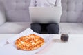 Man eating pizza having a takeaway at home relaxing resting Royalty Free Stock Photo