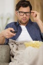 man eating popcorn while watching television Royalty Free Stock Photo