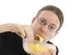 Man eating potato chips hurriedly