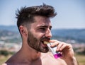 Man eating protein bar outdoor Royalty Free Stock Photo