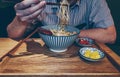 Man is eating ramen in korean cafe Royalty Free Stock Photo