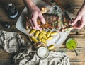 Man eating roasted pork ribs with garlic, rosemary, potato. sauce Royalty Free Stock Photo