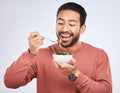 Man is eating salad, healthy food and nutrition with diet, detox and vegetables isolated on studio background. Health Royalty Free Stock Photo