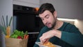 Man eating spaghetti with gluttony