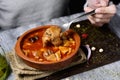 Man eating spanish callos, a stew with beef tripe