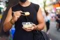 Man eating street food in China Royalty Free Stock Photo