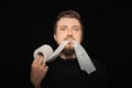 Man eating toilet paper. Hunger strike Royalty Free Stock Photo