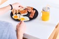 Man eating traditional full English breakfast Royalty Free Stock Photo