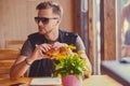 A man eating a vegan burger.