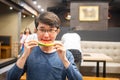 Man eating watermelon in restaurant