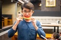 Man eating watermelon in restaurant