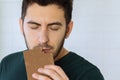 Man eats chocolate with great pleasure