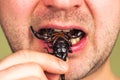 Man eats a scorpion Royalty Free Stock Photo