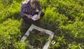 The man ecologist making notes in the diary