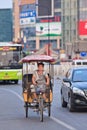 Man on an electric motorized rickshaw, Beijing, China