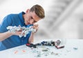 Man with electronics against blurry background Royalty Free Stock Photo