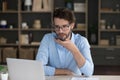 Millennial man holding smartphone talk to client on speakerphone Royalty Free Stock Photo