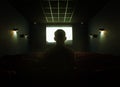 Man in empty cinema hall Royalty Free Stock Photo