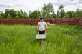 Man with empty wheelbarrow in the grass Royalty Free Stock Photo