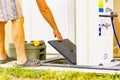 Man emptying caravan tank toilet cassette in dump station Royalty Free Stock Photo