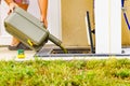 Man emptying caravan tank toilet cassette in dump station Royalty Free Stock Photo