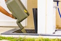 Man emptying caravan tank toilet cassette in dump station Royalty Free Stock Photo