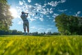 A man is energetically swinging a golf club on a beautifully maintained green field, A golfer analyzing the fairway before the tee