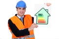 Man with energy rating sign Royalty Free Stock Photo