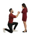 Man with engagement ring making marriage proposal to girlfriend on white background