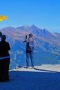 Unknown man photographing mountains in Jungfraujoch, Switzerland on 14 October, 2023, during in the afternoon