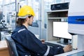 Man engineer using computer blank white screen controlling cnc machine at workshop. Male control automated machine process Royalty Free Stock Photo