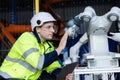 man engineer using teblet control robot arm automate. robotic automation in line production at industrial. Test performance of Royalty Free Stock Photo