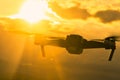 Silhouette of flying drone on sky Royalty Free Stock Photo