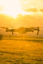 Silhouette of flying drone on sky Royalty Free Stock Photo