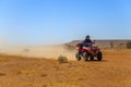 Man riding quad bike in desert