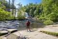 Man enjoying beautiful waterfa view. Royalty Free Stock Photo