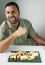 Man enjoying a French cheese board