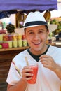 Man enjoying a fruit salad outdoors salpicon Royalty Free Stock Photo