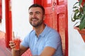 Man enjoying a fruit salad outdoors salpicon Royalty Free Stock Photo